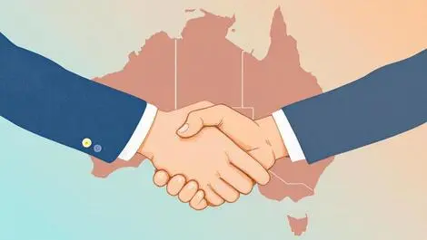 Handshake between two people with stylized map of australia highlighting victoria